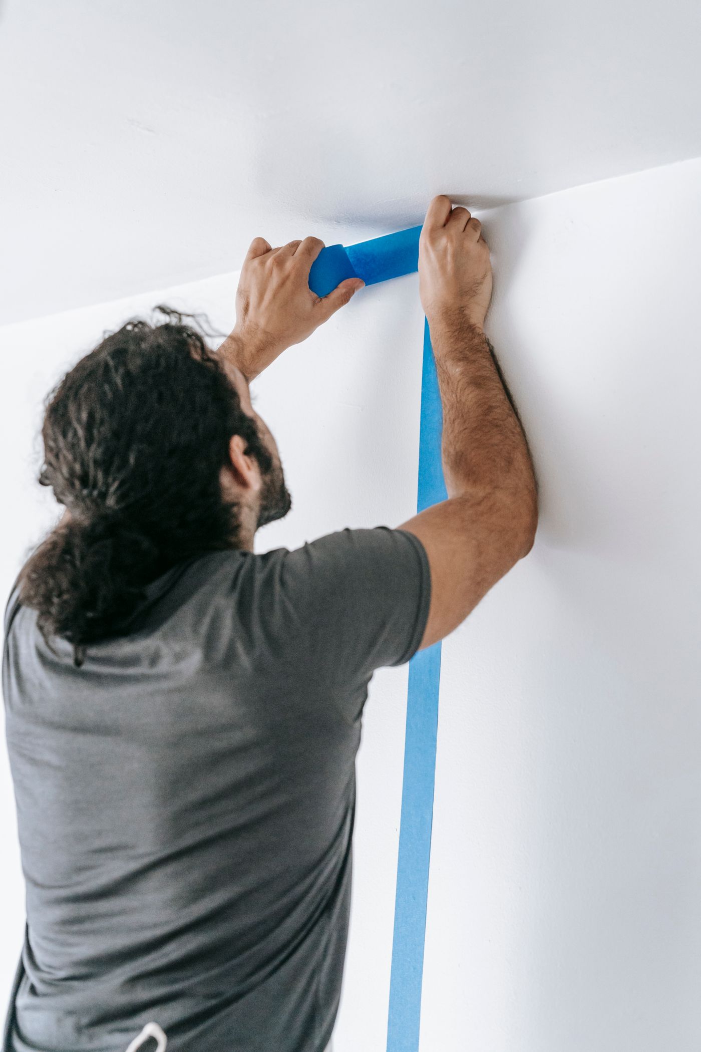 Escalera Finishes crew preparing walls for finish work